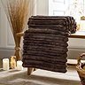 image of carved faux fur brown throw on bench