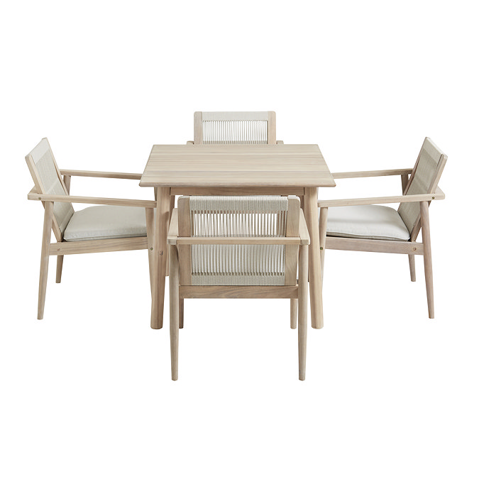 image cut out on white background of four acacia wood chairs around square dining table