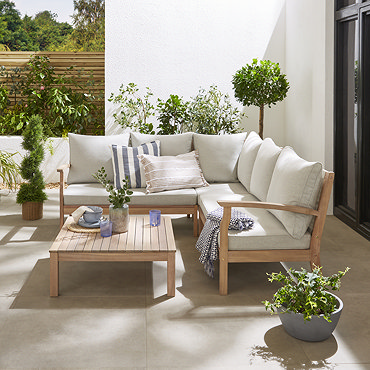 slightly angled image taken from above of cream corner sofa with rectangular acacia wood table