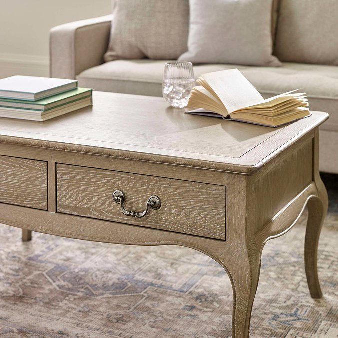 close up image of drawers on limed oak french style coffee table with antique handles