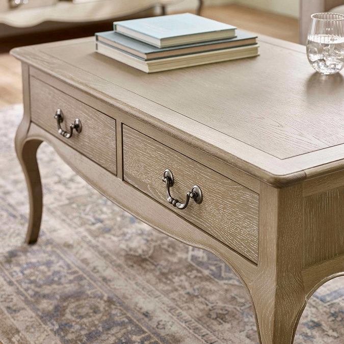 close up angled image of slim drawers of french style coffee table
