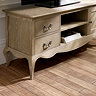 close up image on curved shaping of limed oak tv unit
