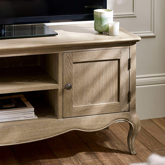 close up image on small cupboard door of french style tv unit