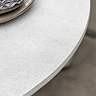close up image of concrete tabletop of cream garden dining table