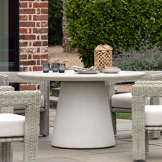 image of concrete garden dining table with round top and conical base