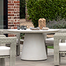 image of concrete garden dining table with round top and conical base