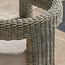 close up image of round back of wicker garden dining chair