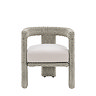 front on image cut out on white background of wicker round backed dining chair with plush cream cushion