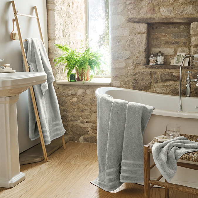 image of soft grey bathroom towels in wide scene