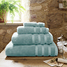 Ocean blue towel stack in bathroom image 1