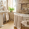 wide image of pumice coloured towel collection in bathroom