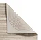 image cut out on white background of large grey-bronze rug, close up on corner folded over to show floor-facing material