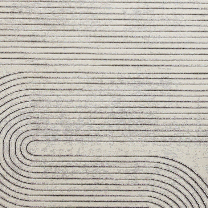 close up on grey rug with ivory geometric pattern woven on, highlighting pattern and texture