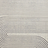 close up on grey rug with ivory geometric pattern woven on, highlighting pattern and texture