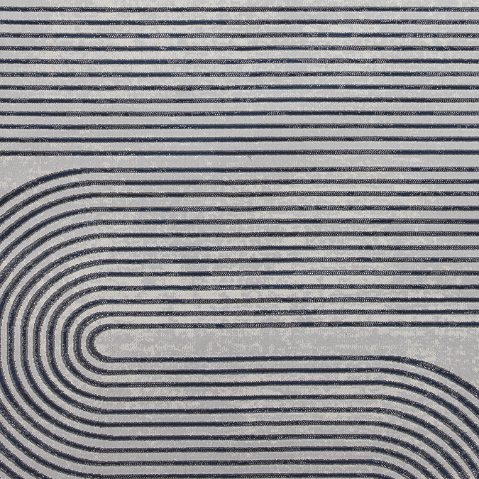close up on navy blue line weave of large rug