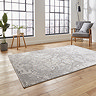 angled image of rectangular grey and ivory rug in modern loft apartment