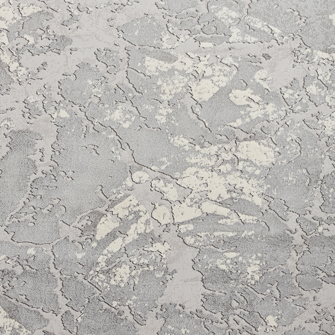 close up image of texture and colour of grey-ivory marble effect rug