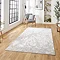 image of large rectangular marble effect grey and ivory rug in loft apartment