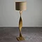 image of tall floor lamp with twisted wooden body and linen shade