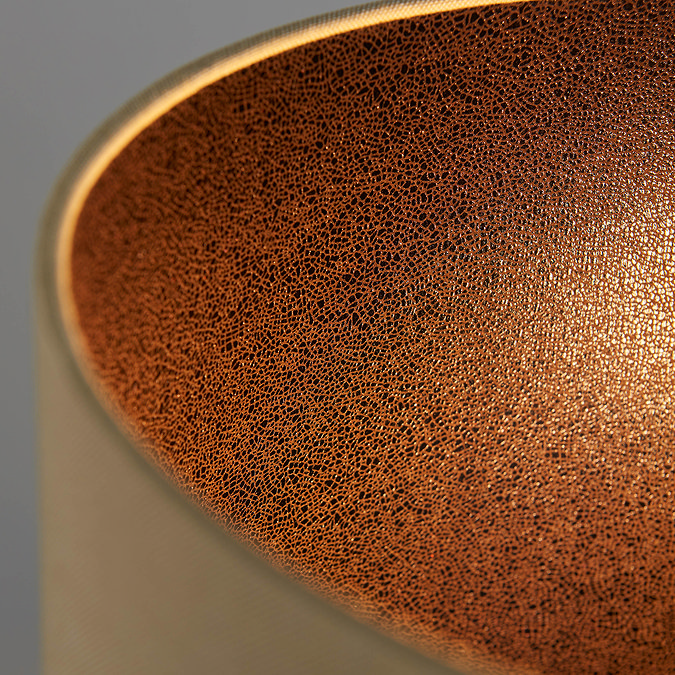 close up on top of lamp to show inside texture of linen shade 