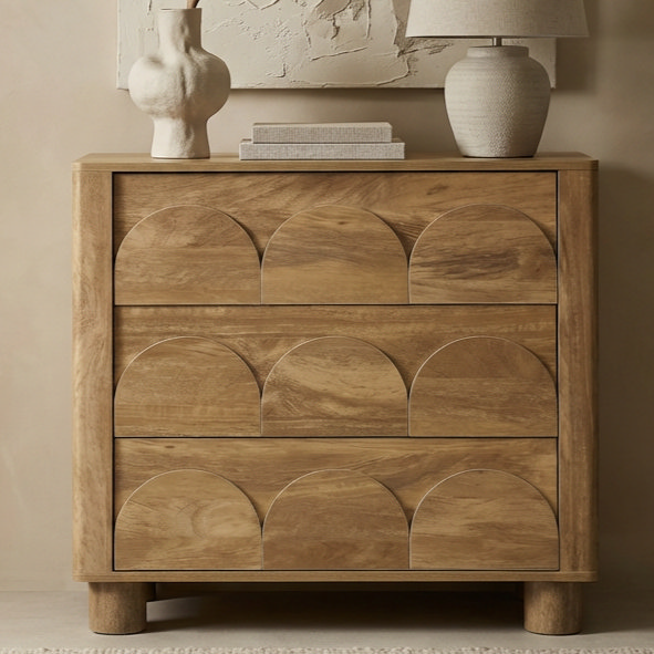 close up image of three drawer chest with arch pattern on front