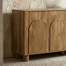 close up image of mango wood effect closed four door sideboard