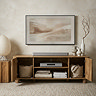 image of mango wood effect tv unit with doors open to show full effect of storage space, with art work hanging above it