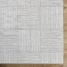 close up image of corner of ivory and brown alternating striped rug