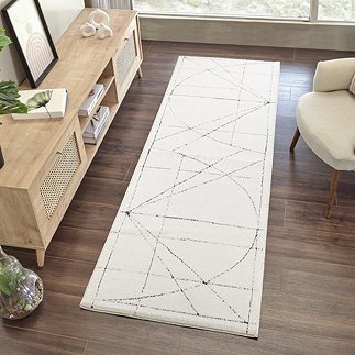 overhead image of ivory runner with black blueprint-inspired pattern