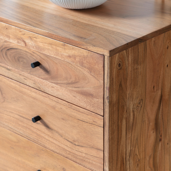 close up on smooth corner of acacia wood sideboard with iron handles