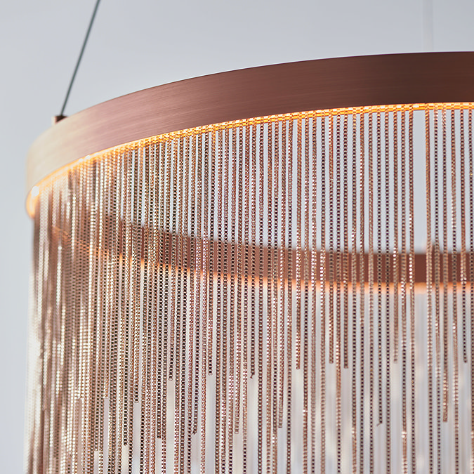 close up on tasselled effect of brushed copper ceiling light