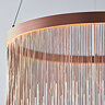 close up on tasselled effect of brushed copper ceiling light