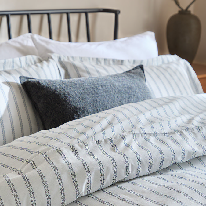 Arlen Navy on bed close up image 2