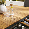 close up on wood teak finish of slatted garden table