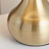super close up image of brass coloured base of table lamp