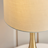 close up on cream linen shade of table lamp