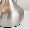 super close up image of shiny nickel lamp base
