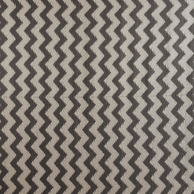 close up image of black and white zigzag patterned rug