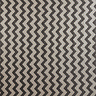 close up image of black and white zigzag patterned rug
