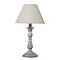 image cut out on white background of grey lamp with linen shade