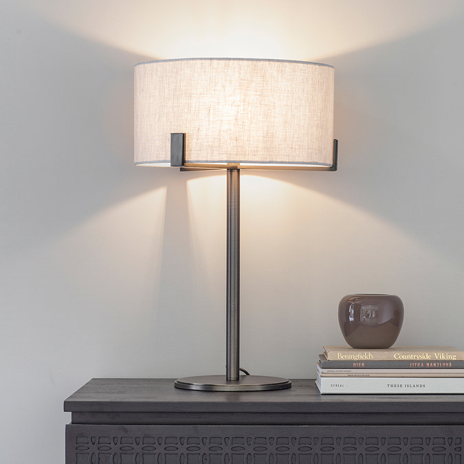 image of bronze table lamp with linen shade on side table