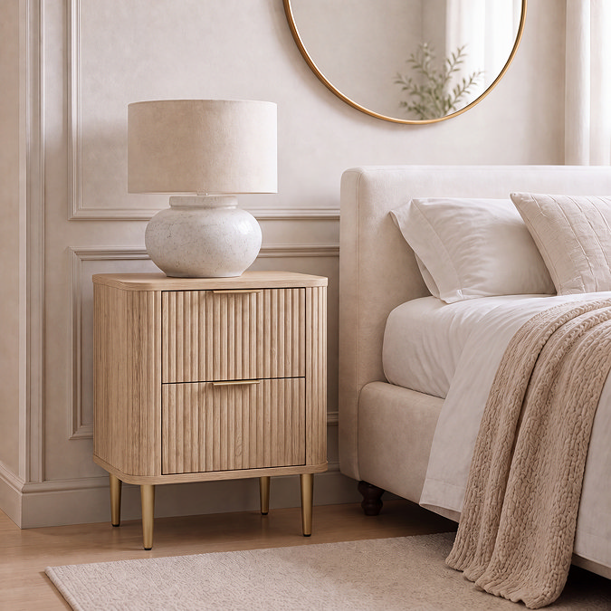 lifestyle image of two drawer oak fluted bedside table
