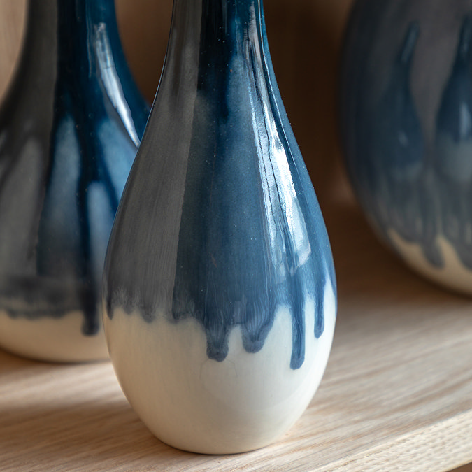 close up on white bottom half of drip fade effect vase