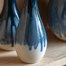 close up on white bottom half of drip fade effect vase
