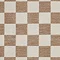 close up on beige checkered rug, highlighting colours and texture