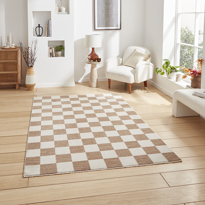 image of large rectangle rug in checkerboard beige and white pattern on wooden floor of modern loft apartment