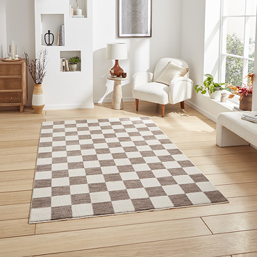 angled image of grey checkered rug on light wooden flooring
