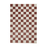 image cut out on white background of checkered plum and cream rug