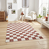 image of plum and cream checkerboard rectangle rug on light wooden floor of modern loft apartment