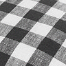 close up image of checkered black and white patterned cushion